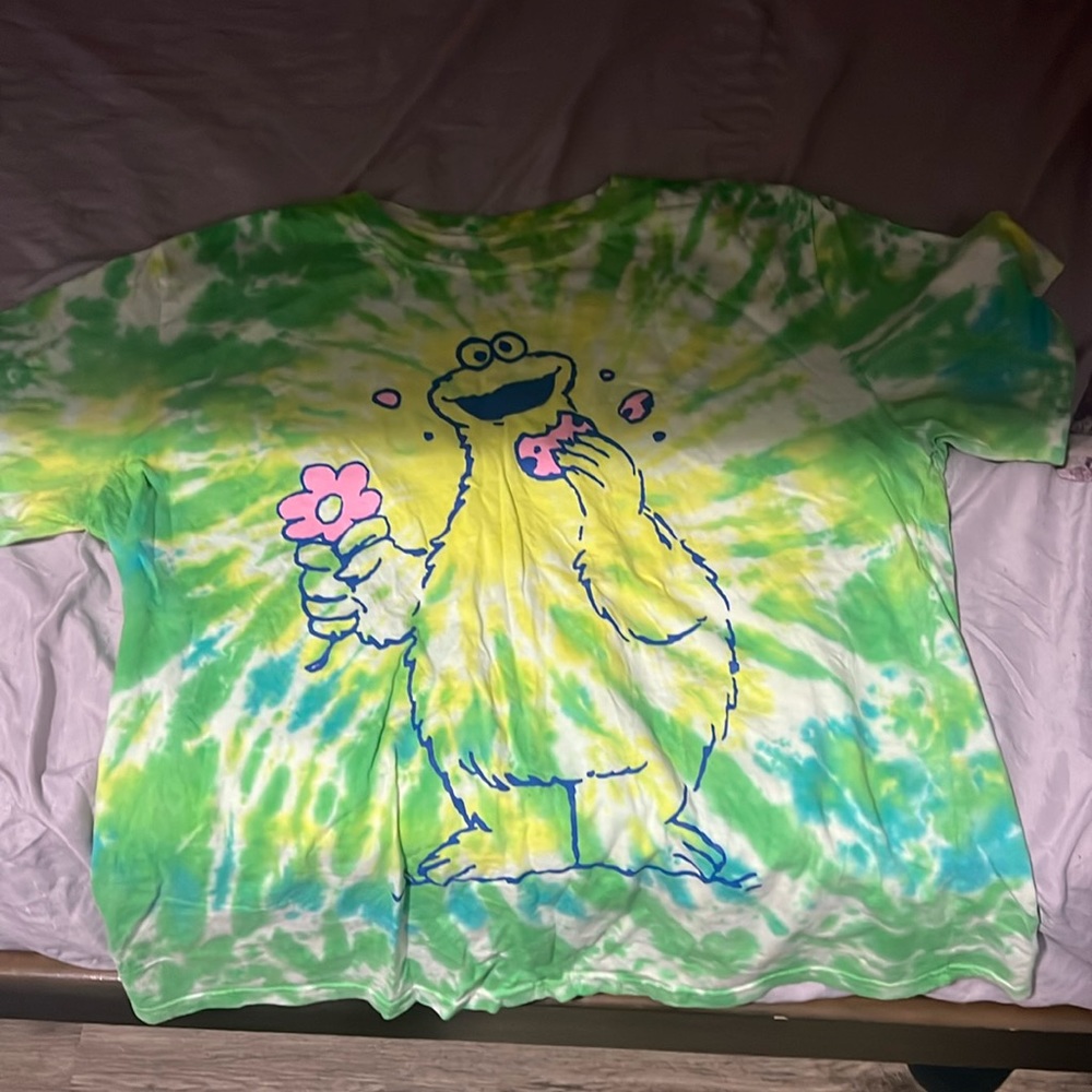 selling a tie-dye sesame street tee shirt